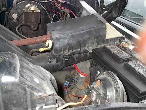 1979 Ford Bronco - Engine bay components including battery, fuse box, and brake fluid reservoir are visible.