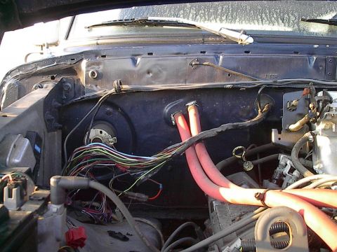 1979 Ford Bronco - The engine bay shows a complex network of wires and red hoses, with a watermark indicating the source of the image.