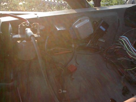 1979 Ford Bronco - Close-up view of the engine bay, showing various wires and electrical components.