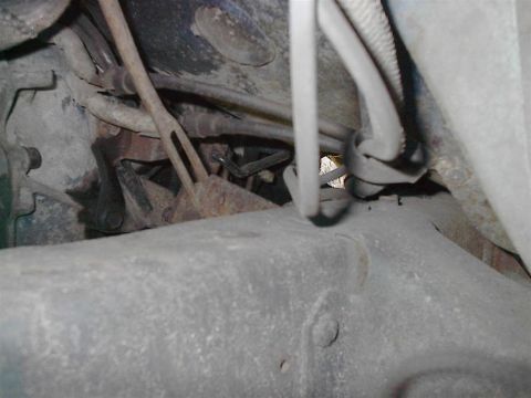 1979 Ford Bronco - Close-up view of the undercarriage, showing various hoses and metal parts, with a Supermotors.net watermark visible.