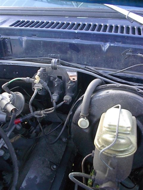 1979 Ford Bronco - Engine bay components, including brake booster and vacuum lines, are shown in this close-up view.
