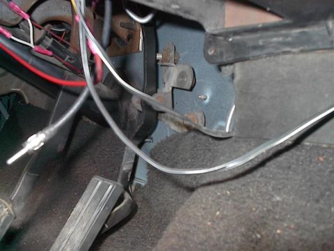 1979 Ford Bronco - Close-up view of wiring and pedals inside a vehicle, with a SuperMotors watermark visible.