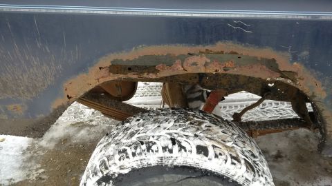 1979 Ford Bronco - Significant rust is visible on the vehicle's frame and wheel well, indicating potential structural issues.