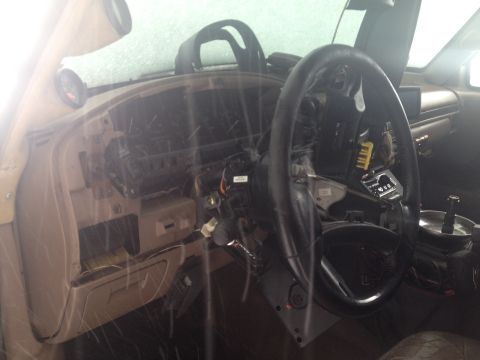1993 Ford Bronco - Interior view of a 1993 Ford Bronco with the dashboard removed for work.