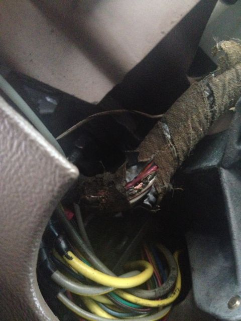1993 Ford Bronco - This photo shows a damaged wiring harness with exposed wires and frayed insulation.