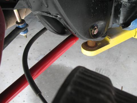 1972 Ford Ranchero - Undercarriage view showing suspension parts, including a red bar and black hoses, with Supermotors.net watermark.