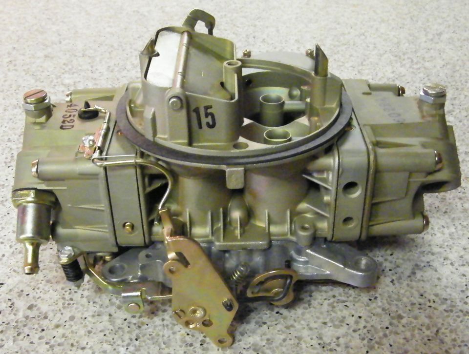 Close-up of a Holley carburetor with a number 15 visible on top
