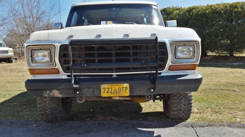 White 1978 Ford Bronco front view with a black grille guard and yellow Virginia license plate