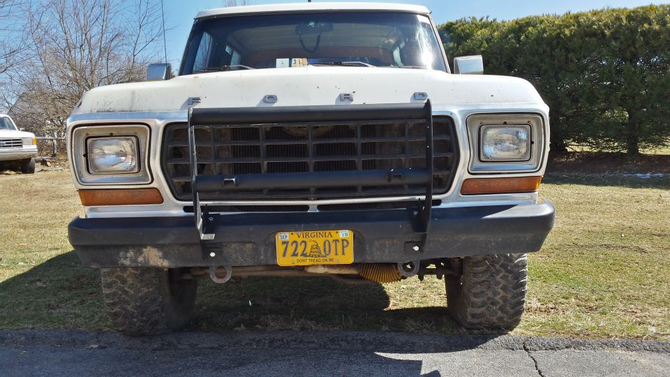 White 1978 Ford Bronco front view with a black grille guard and yellow Virginia license plate