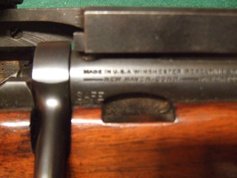 1996 Ford Bronco - Close-up of a Winchester rifle receiver showing manufacturing details and location.