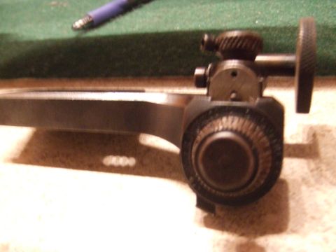 1996 Ford Bronco - A detailed view of a firearm's adjustable rear sight mechanism, showing its intricate components.