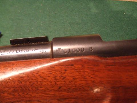 1996 Ford Bronco - A close-up view of a rifle barrel with visible markings and serial number.