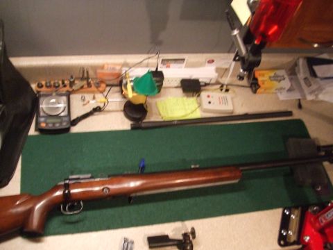 1996 Ford Bronco - Rifle and reloading equipment laid out on a workbench.
