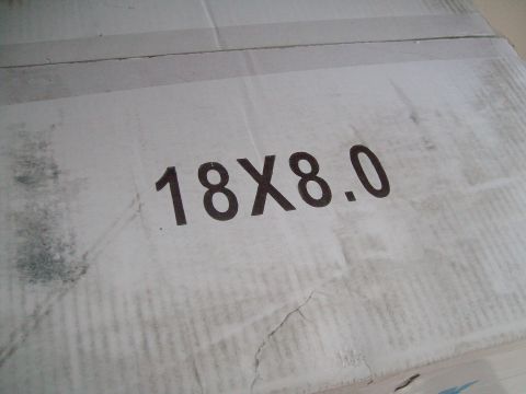 2004 Ford Crown Victoria - Box shows dimensions 18X8.0, likely for wheels or tires.