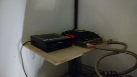 1995 Ford Bronco - An electronic device and plumbing components are visible on a shelf, with a Supermotors.net watermark in the corner.