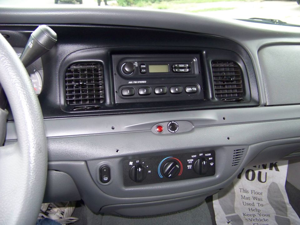 Oooh. AM/FM Radio. No front speakers as they were co-opted for the police radios...