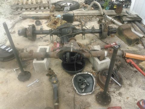 1996 Ford Bronco - I went ahead and pulled the cover and drained the fluid. Pulled the spider gears out and then the axle shafts. I measured the axleshafts fo…
