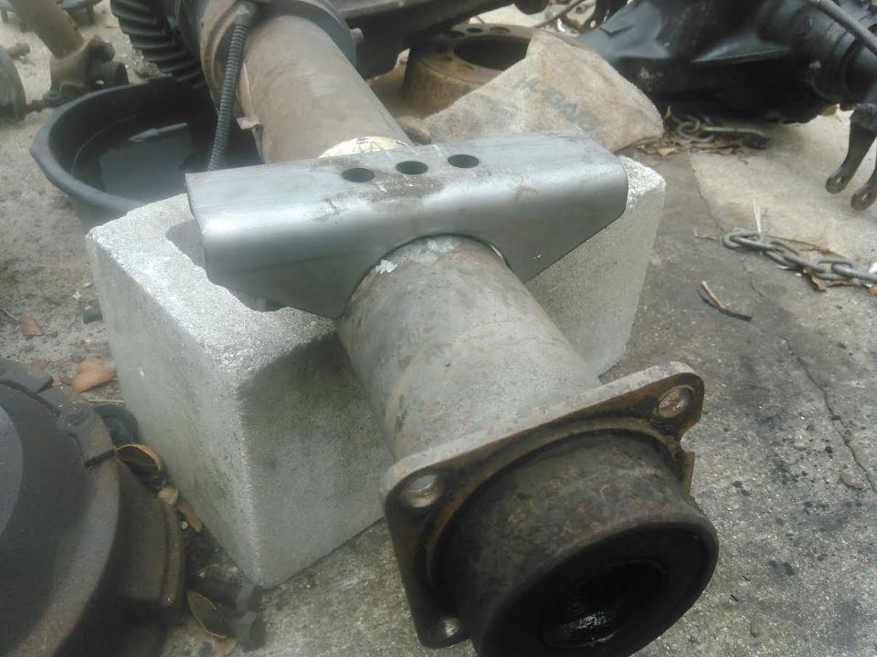 new leaf spring perch from Ruffstuff. I had to grind them abit to make them fit good around the axletube but nothing too much. these perches are great and designed to be long to prevent axle wrap,  and have 3 different holes for moving the axle forward or backwards an inch.

I am going to wait to weld these on till after the axle is under the truck and weight is on the axle. Once its under the truck with weight on the suspension, im going rotate the axle so I can get the pinion angle of the driveshaft perfect. this will eliminate the need for the factory angle blocks found on the broncos and it will also make it better for 3" lift I got from my F250 springs