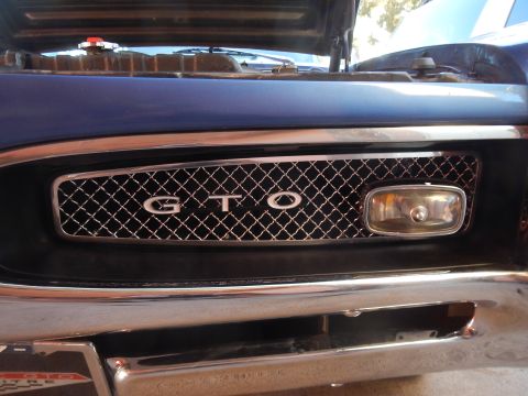 1967 Pontiac GTO - Close-up of the front grille of a 1967 Pontiac GTO, showing the iconic GTO badging.