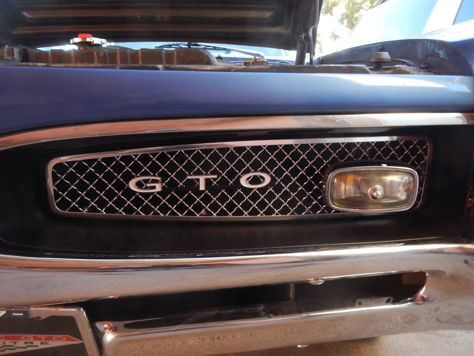 1967 Pontiac GTO grille with chrome trim and a single headlight