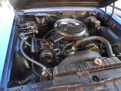 1967 Pontiac GTO - Close-up view of the engine compartment, detailing the V8 engine and associated components.