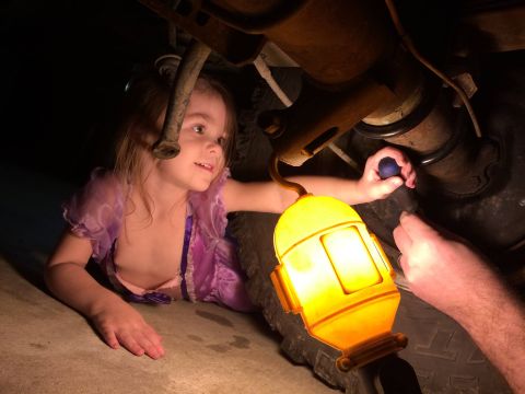 1991 Ford Bronco - Arabella (3 yo) helping turn the adjuster - wearing a Sophia the First constume.