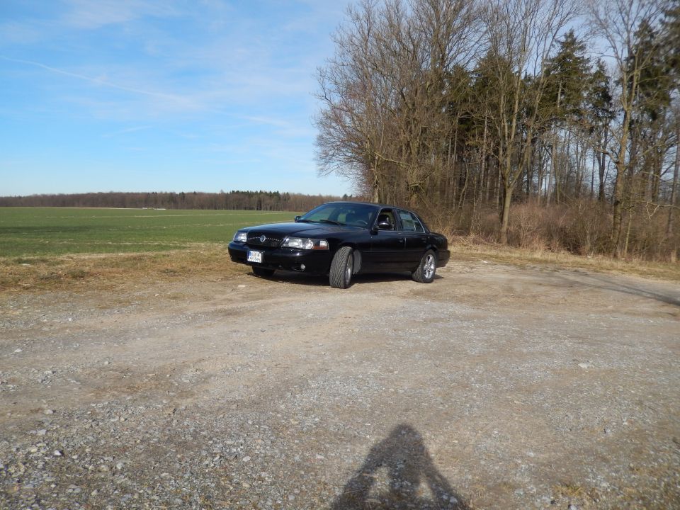 Black 2003 Mercury Marauder parked on gravel, 3q-front view