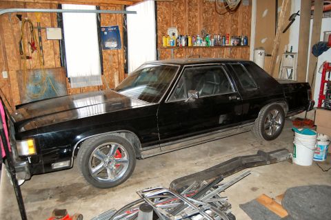 1985 Mercury Grand Marquis - This 1985 Mercury Grand Marquis coupe is parked inside a garage, showing its distinctive body style.