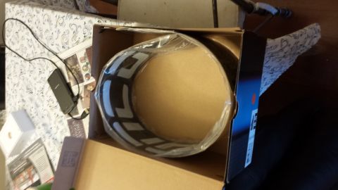 1995 Ford Bronco - An air filter is shown inside its packaging, resting on a table.