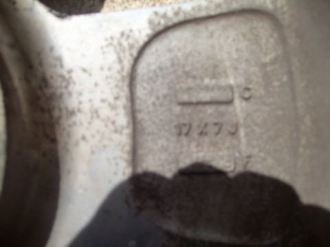 2004 Ford Crown Victoria - Close-up of a vehicle wheel part showing casting numbers, including 17273.