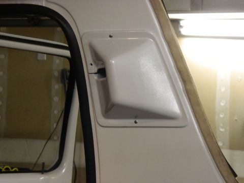 1979 Ford Bronco - Close-up of a white interior vent located on the pillar of a vehicle.