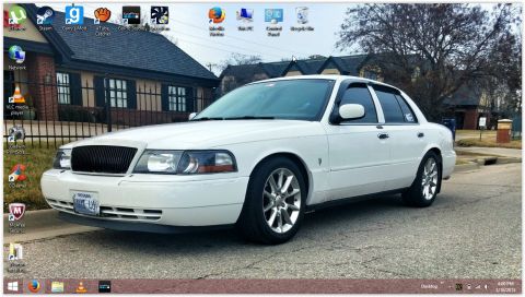 2000 Mercury Grand Marquis - White 2000 Mercury Grand Marquis parked on a residential street with desktop icons overlayed.