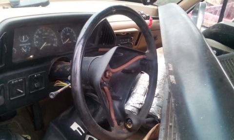 1988 Ford F-150 - The interior of a 1988 Ford F-150 shows the dashboard, steering wheel, and gauges.