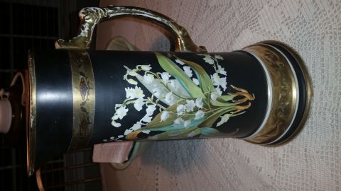 2015 Chevrolet new - A decorative beer stein a detailed painting of lily of the valley flowers is shown.