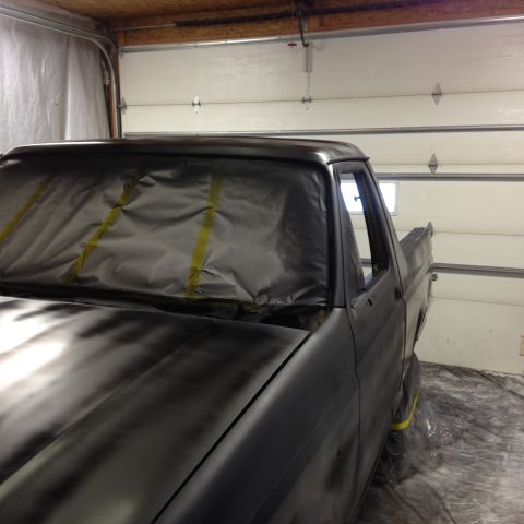 1992 Ford Bronco - A truck is being prepped for painting inside a garage.