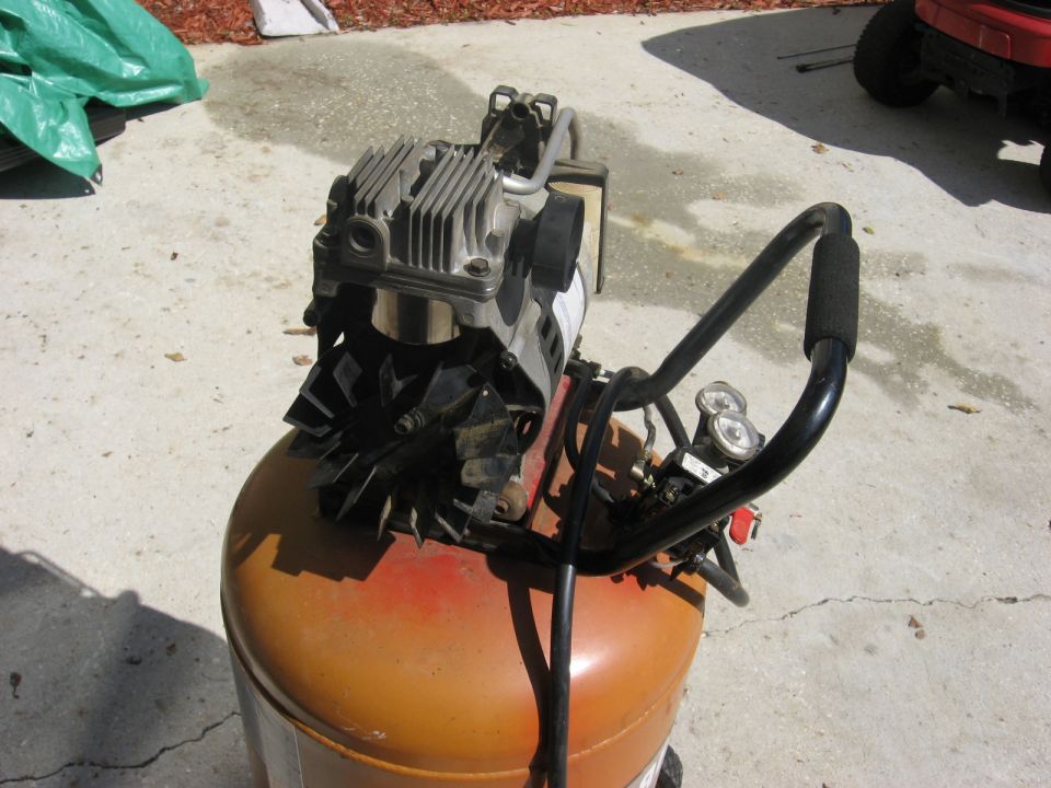 Portable air compressor with orange tank and silver motor