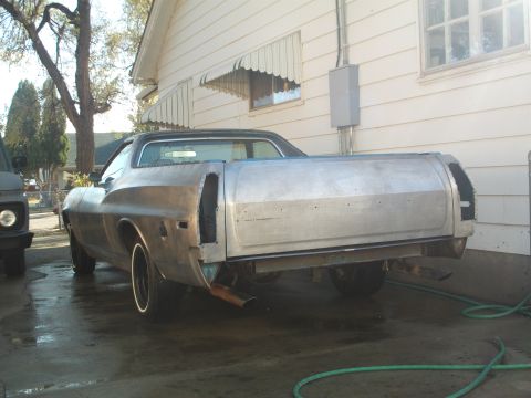 1973 Ford Ranchero - This 1973 Ford Ranchero is undergoing restoration, showing its bare metal body from the rear.