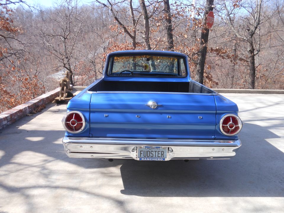 1965 Ford Ranchero pickup truck, rear view. Blue paint, chrome bumper, round taillights