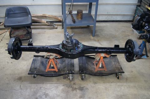 1979 Ford Bronco - A black rear axle assembly is shown on jack stands in a garage setting.