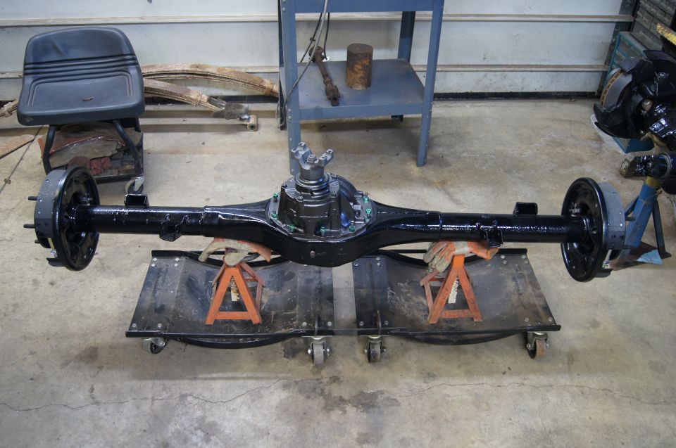 black rear axle assembly on jack stands