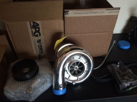 2003 Mercury Marauder - A Vortech supercharger is shown with associated parts and boxes from APG Power Group and Vortechsuperchargers.com.