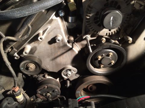 2003 Mercury Marauder - Close-up view of engine components including pulleys, alternator, and compressor clutch.