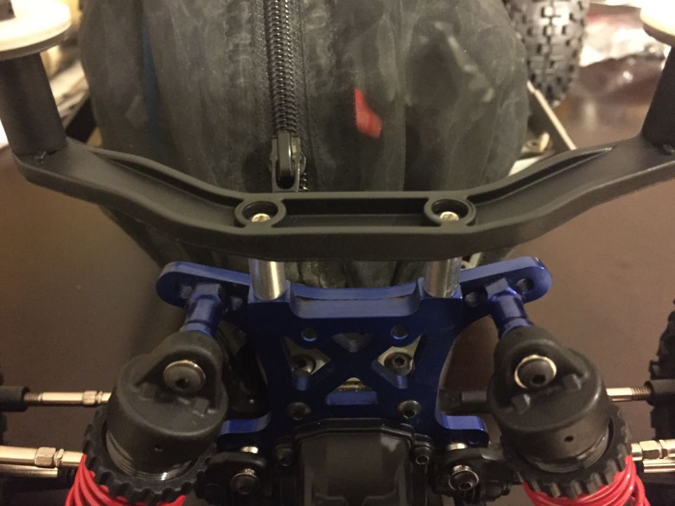 RC car steering assembly with blue metal components and black handlebars