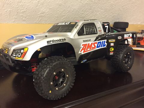 2014 Dodge 1500 - This remote-controlled truck features racing decals and large off-road tires.