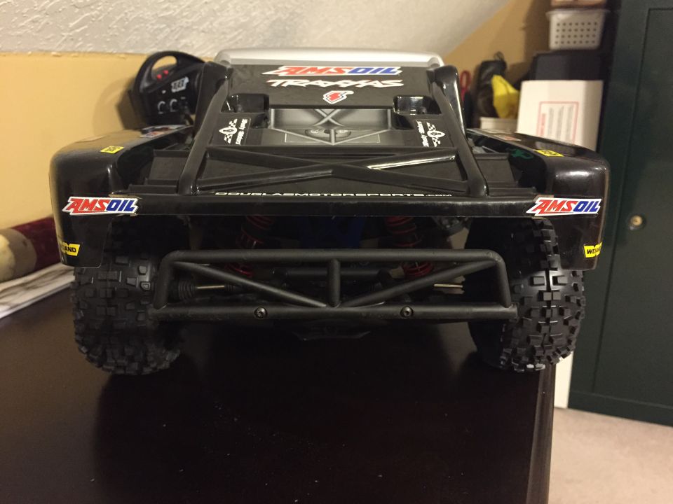 Black remote control truck with AMSOIL decals, rear view