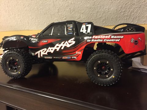 2014 Dodge 1500 - This Traxxas radio-controlled truck features racing decals and the slogan 'The Fastest Name in Radio Control'.