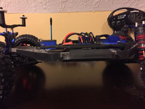 2014 Dodge 1500 - Close-up of an RC car's chassis, showing its internal components and suspension.
