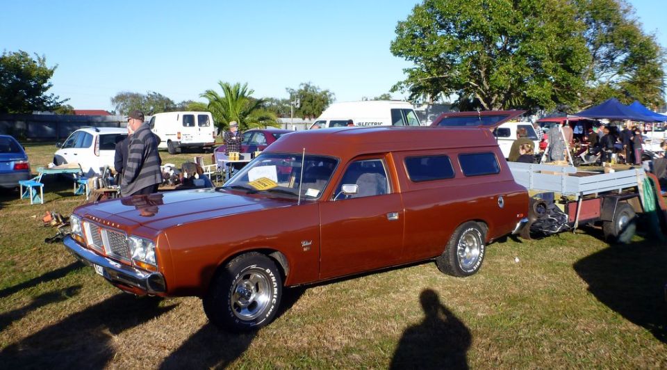 Brown panel van with trailer, 3q front view