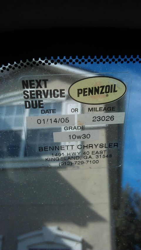 1994 Ford Bronco - A service sticker indicates the next oil change is due January 14, 2005, at 23,026 miles.
