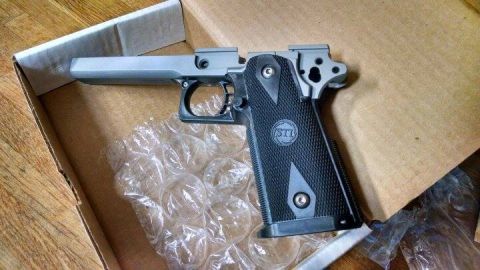 1996 Ford Bronco - A pistol frame with an STI logo is shown in a cardboard box with bubble wrap.
